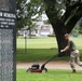 Marine mows grass at memorial