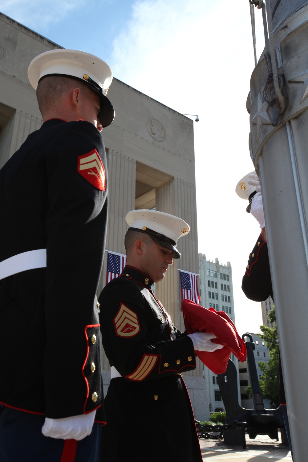 Hoisting the Corps' colors