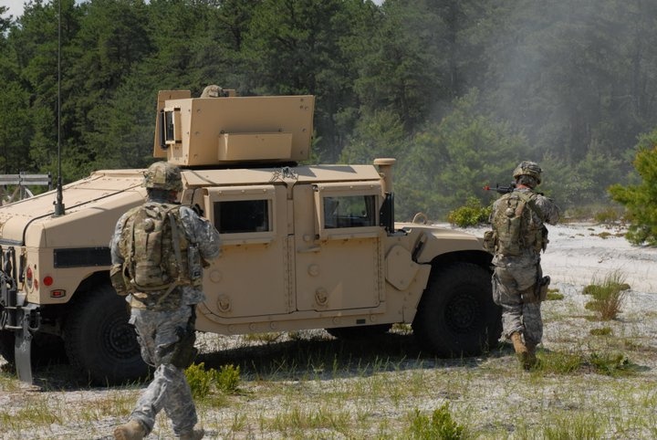 Soldiers run for cover during a fire fight