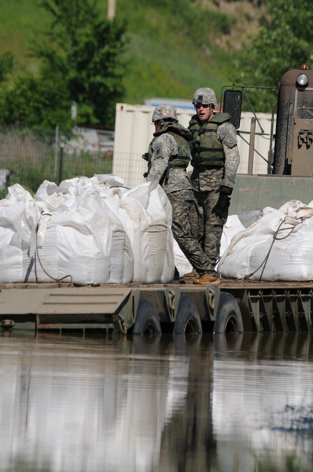 Black Hawks reinforce flood levees in Minot