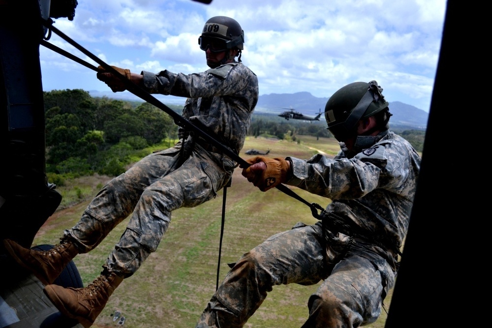 CAB soldiers assault through air assault course