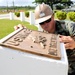 NMCB 133 sailor installs plaque in Guam