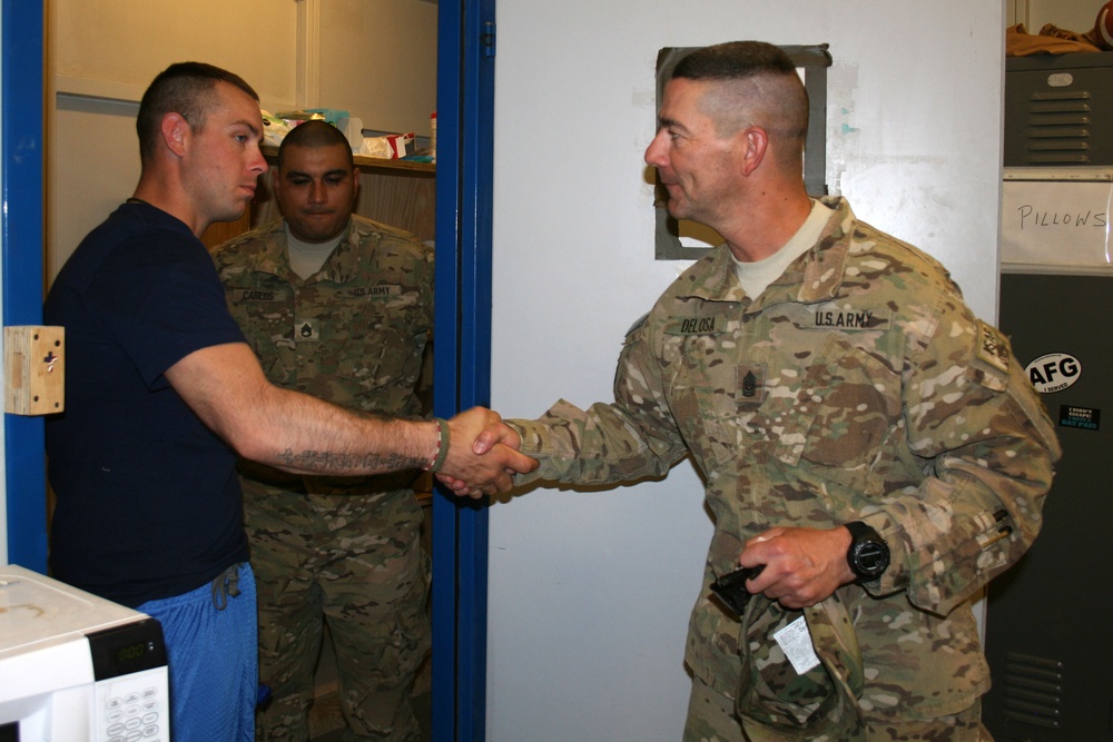 CSM Delosa awards soldier Warhorse coin