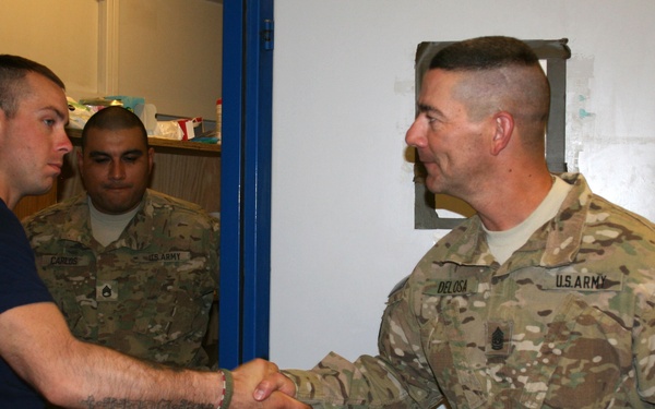 CSM Delosa awards soldier Warhorse coin