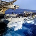 LCU 1665 offloads passengers on USS Cleveland