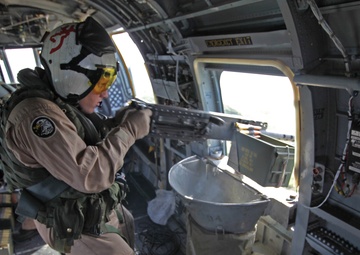 Marines gain proficiency with machine guns during flight