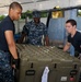 Sailors load supplies in Puerto San Jose