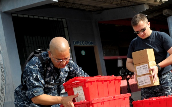 Sailors load supplies in Puerto San Jose