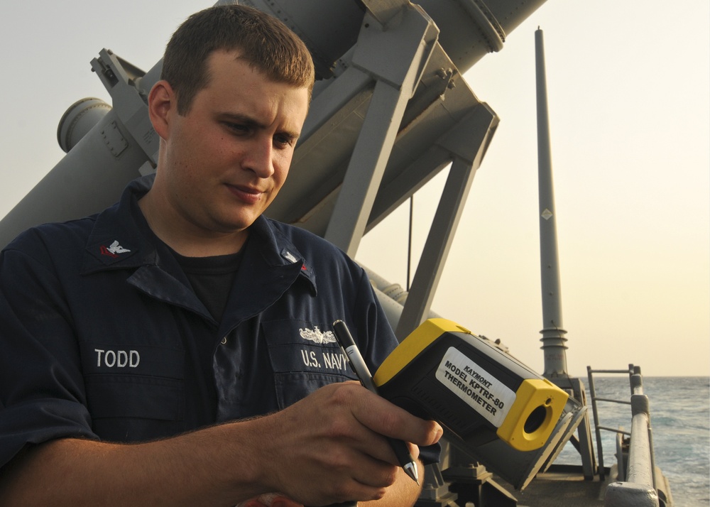 USS Anzio sailor tests water temperature