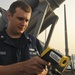 USS Anzio sailor tests water temperature