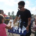 Sailor gives Guataemalan children water outside medical site