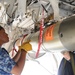 Airman handles torpedo