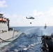 USS Mustin conducts replenishment