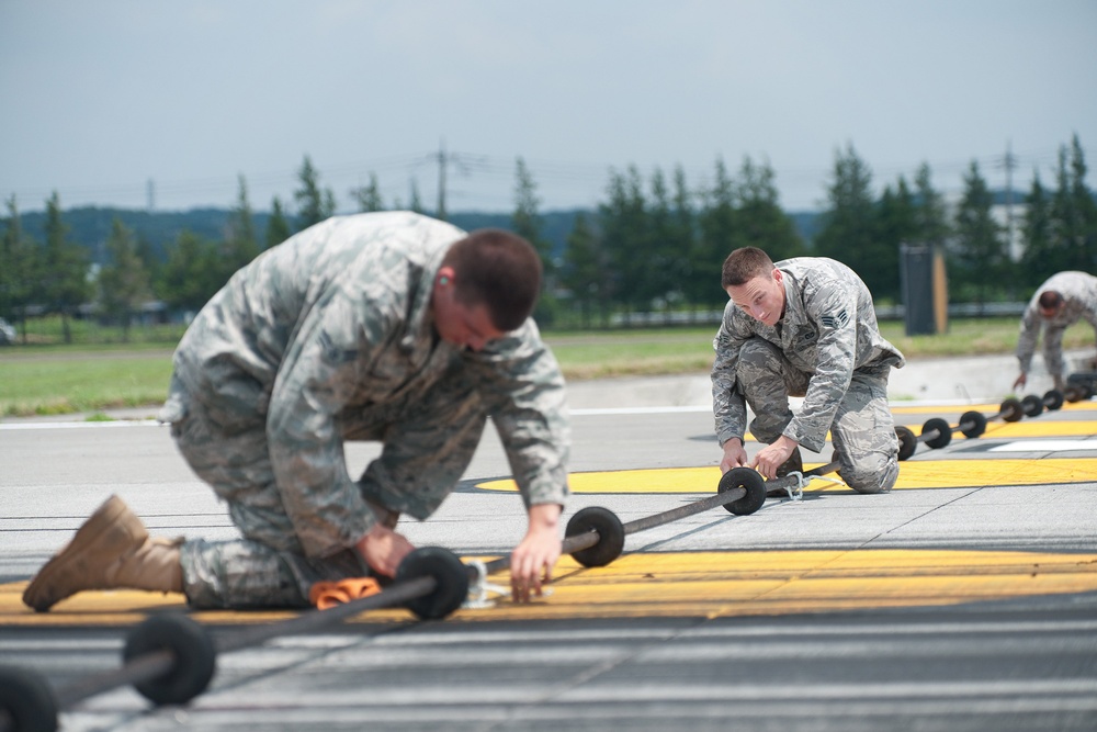 Yokota airmen perform annual aircraft arresting barrier systems certification tests