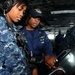Officer observes sailor on USS Ronald Reagan bridge