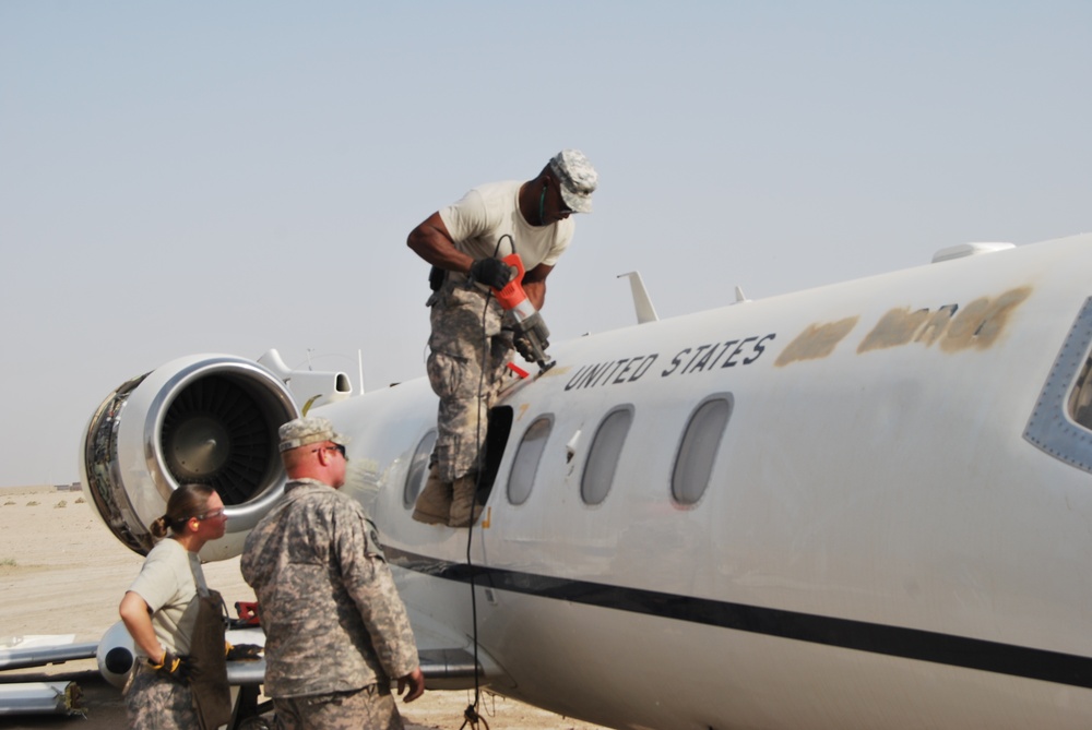 Soldiers and airmen recover, dismantle damaged aircraft