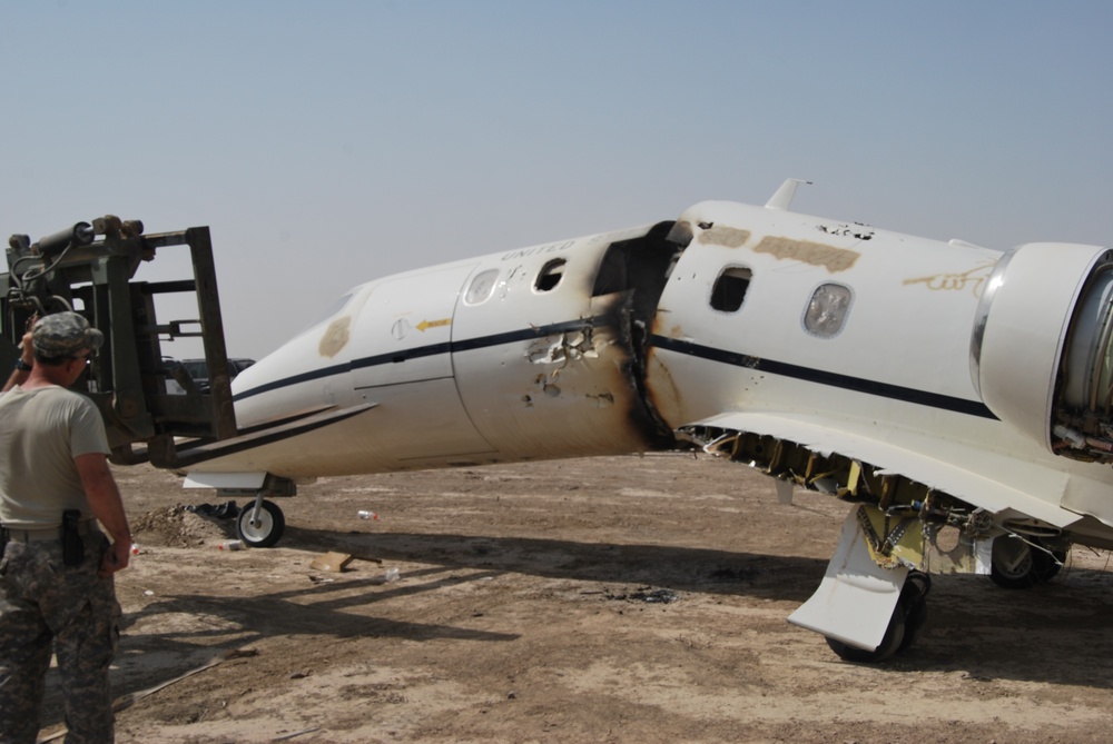 Soldiers and airmen recover, dismantle damaged aircraft