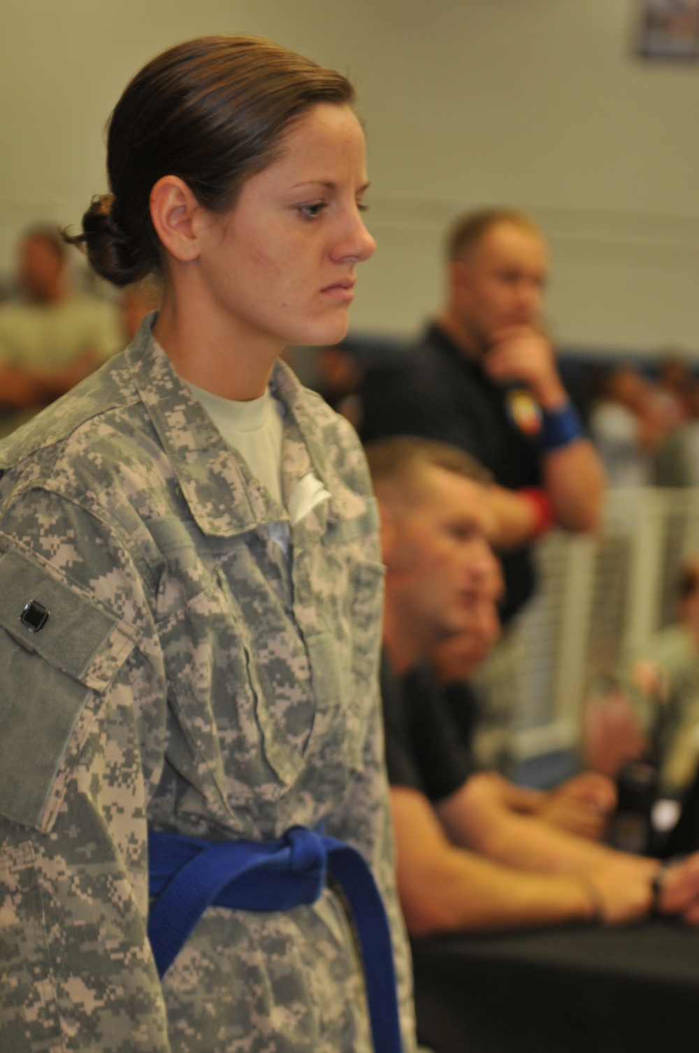 Dog Face soldier contemplates match during All-Army Combatives Tournament