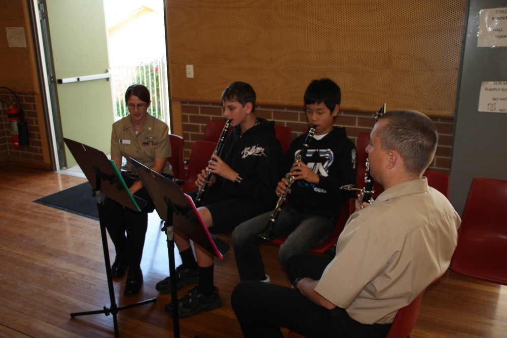 US 7th Fleet Band give some guidance to clarinet players at Banora Point Primary School during Talisman Sabre 2011