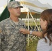 Daughter pins rank of responsibility during lateral promotion