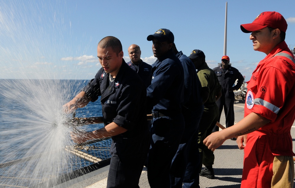 USS Blue Ridge sailors demonstrate proper hose procedure