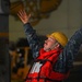 USS Abraham Lincoln rig captain directs a pallet during replenishment