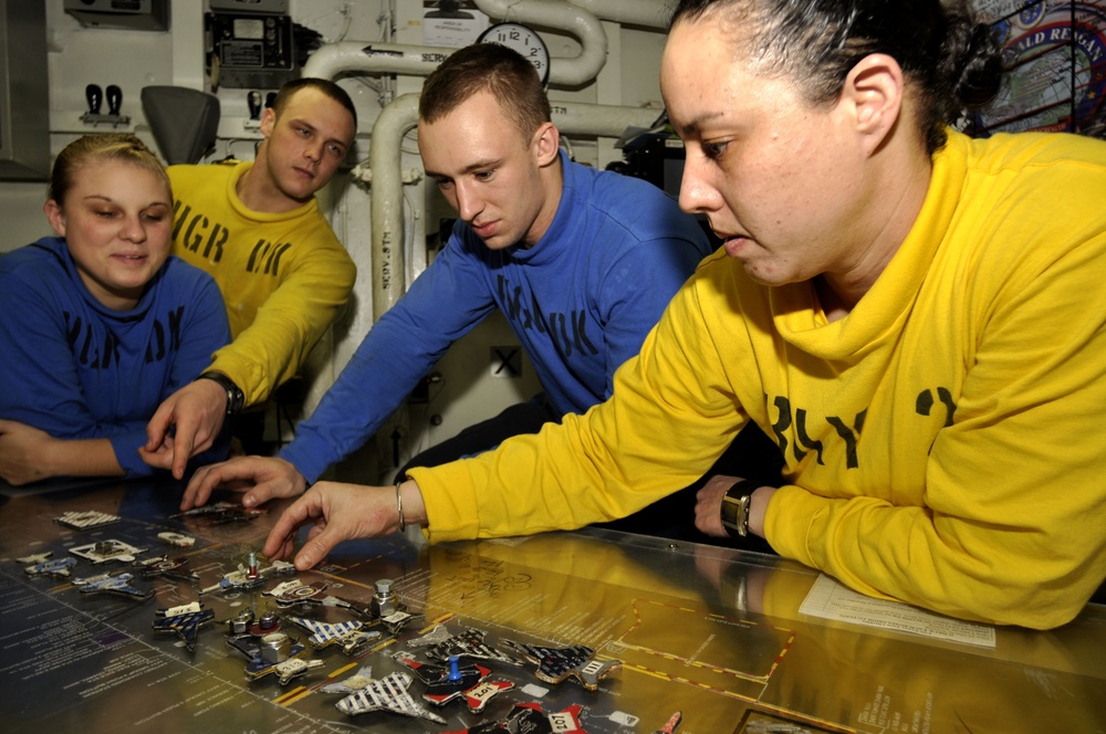 USS Ronald Reagan sailors stage aircraft models