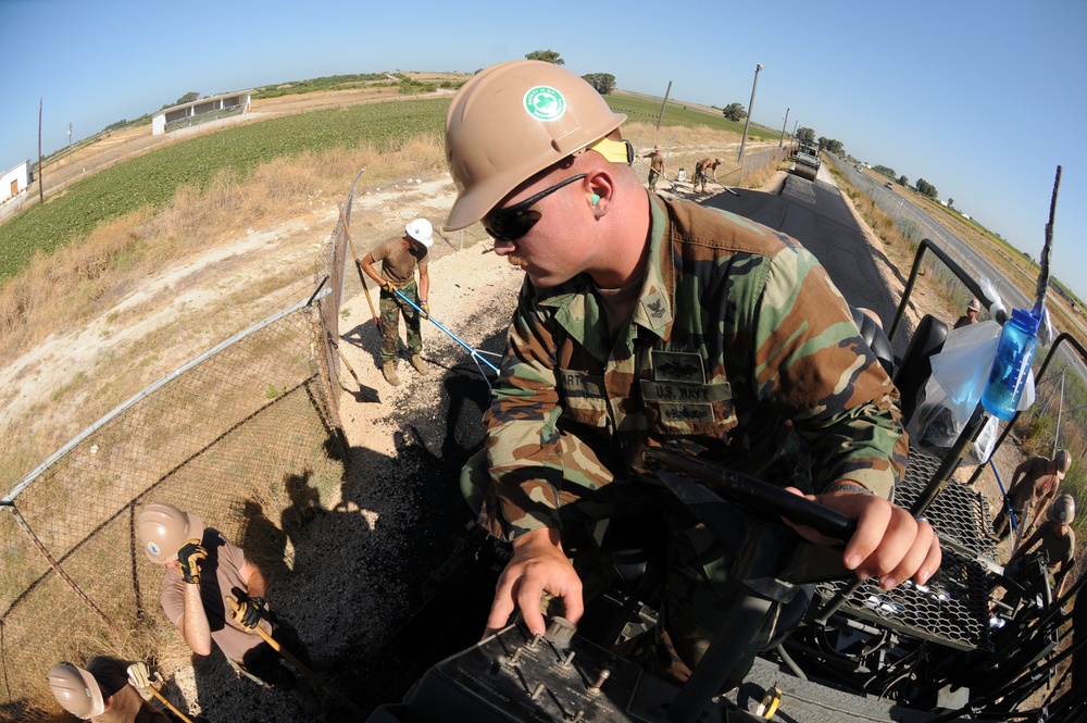 NMCB 74 Seabee lays asphalt in Rota