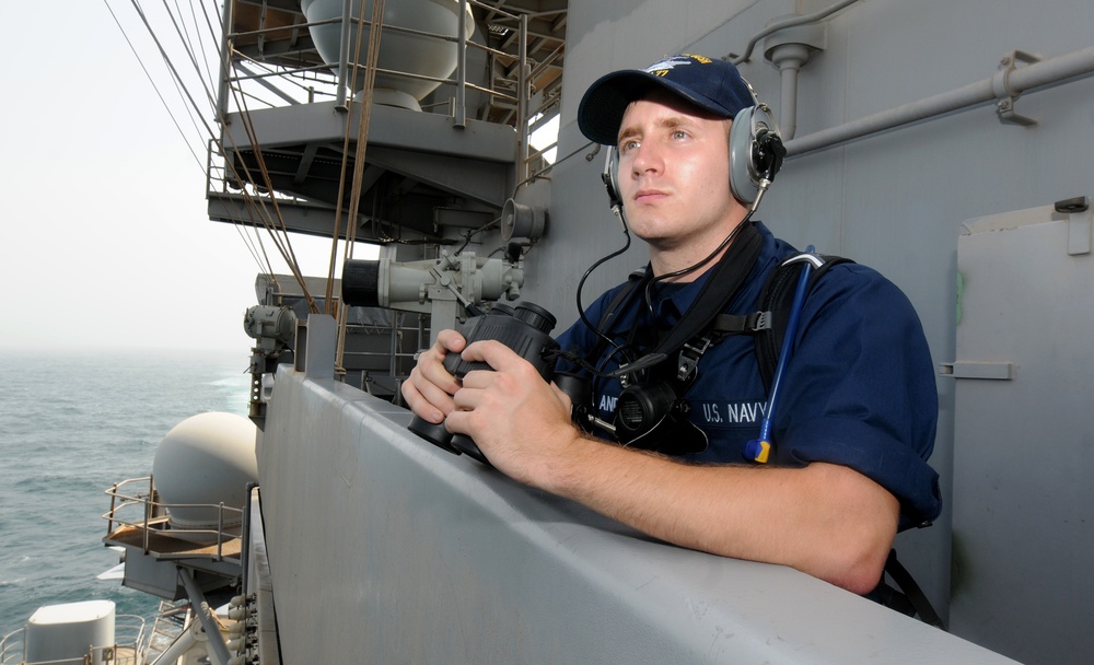 USS George H.W. Bush sailor stands lookout