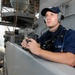 USS George H.W. Bush sailor stands lookout