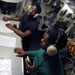 USS George H.W. Bush sailors in catapult room