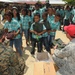 Service members deliver supplies to Suriname children
