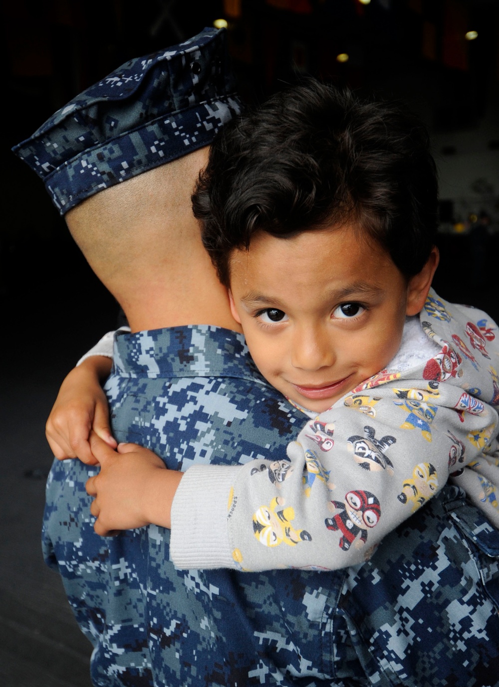 USS John C. Stennis sailor hugs son