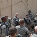 1st Battalion, 7th Field Artillery Regiment Soldiers prepare for a patrol with 1st Federal Police Division counterparts