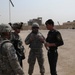 1st Battalion, 7th Field Artillery Regiment Soldiers prepare for a patrol with 1st Federal Police Division counterparts