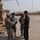 1st Battalion, 7th Field Artillery Regiment Soldiers prepare for a patrol with 1st Federal Police Division counterparts