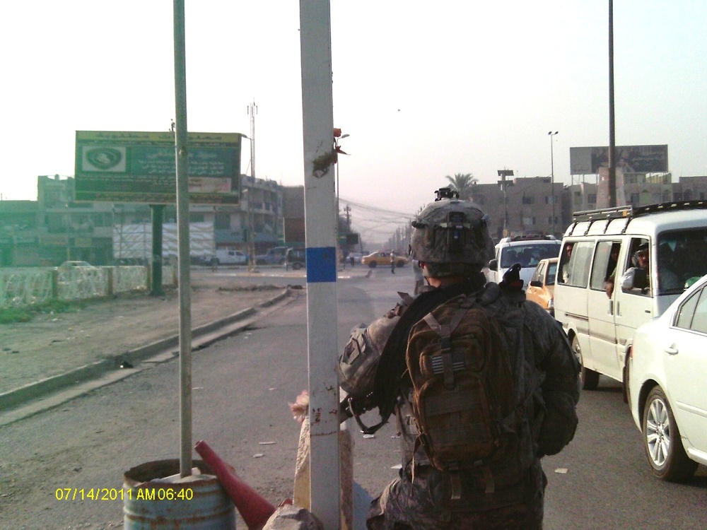 First Battalion, 7th Field Artillery Regiment, and 1st Federal Police Division counterparts patrol in Baghdad