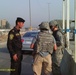 First Battalion, 7th Field Artillery Regiment, and 1st Federal Police Division counterparts patrol in Baghdad