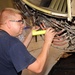 97th Maintenance member inspects engine