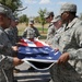 Airmen from the 97th Medical Group participate in a retreat flag folding ceremony