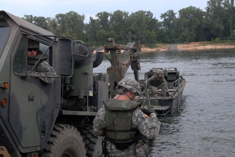 Bridge constructors with the 652nd Engineer Company unload a 50 Boat