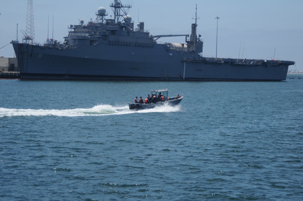 Naval Base San Diego sailors perform harbor maintenance