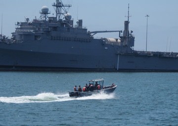 Naval Base San Diego sailors perform harbor maintenance