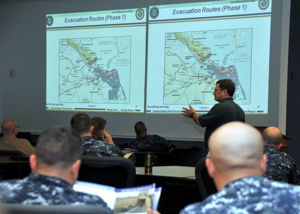 Commander, US 2nd Fleet sailors attend a disaster preparedness briefing conducted by Gene Lambert, emergency manger for Naval Station Norfolk