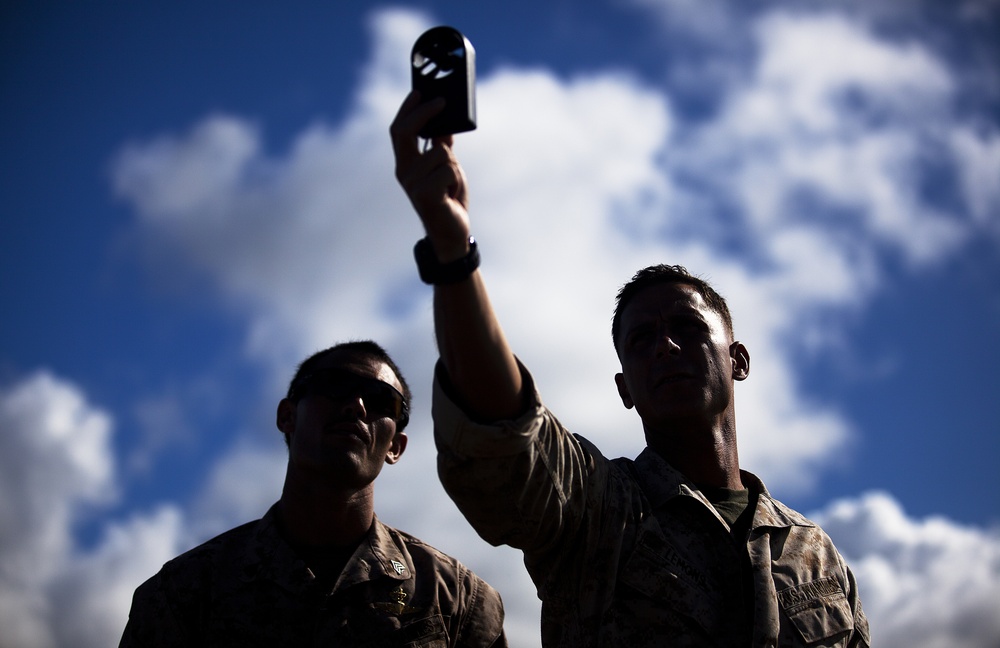 Parachutes over paradise: Force Recon Marines, SEALs, Army and Air Force paratroopers glide over Marine Corps Base Hawaii