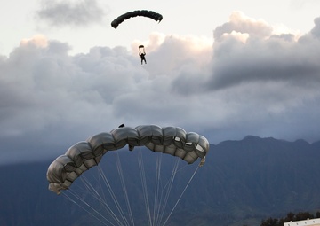 Parachutes over paradise: Force Recon Marines, SEALs, Army and Air Force paratroopers glide over Marine Corps Base Hawaii