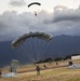 Parachutes over paradise: Force Recon Marines, SEALs, Army and Air Force paratroopers glide over Marine Corps Base Hawaii