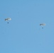 Parachutists deliver American flag for Rodeo opening ceremony