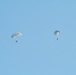 Parachutists deliver American flag for Rodeo opening ceremony