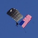 Parachutists deliver American flag for Rodeo opening ceremony